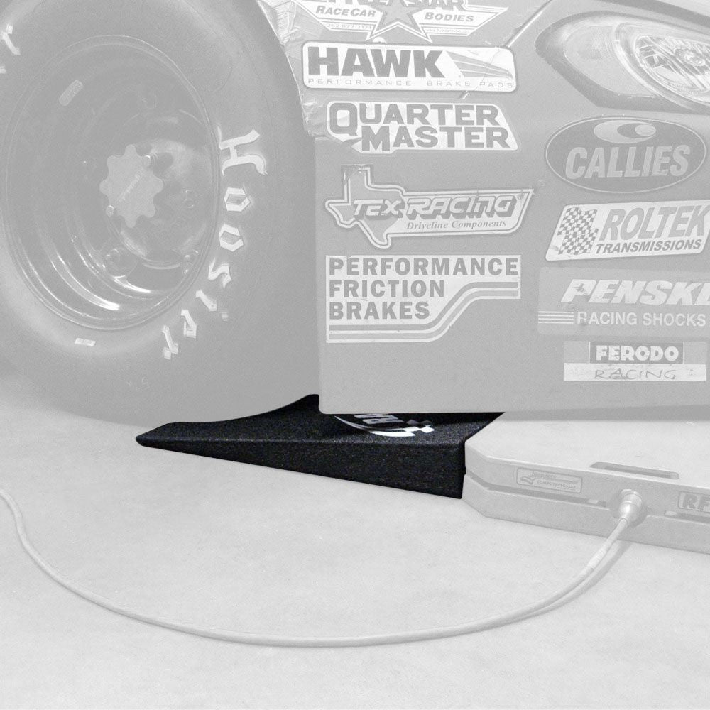 Race car wheel on a racing scale with a Race Ramps scale ramp in front