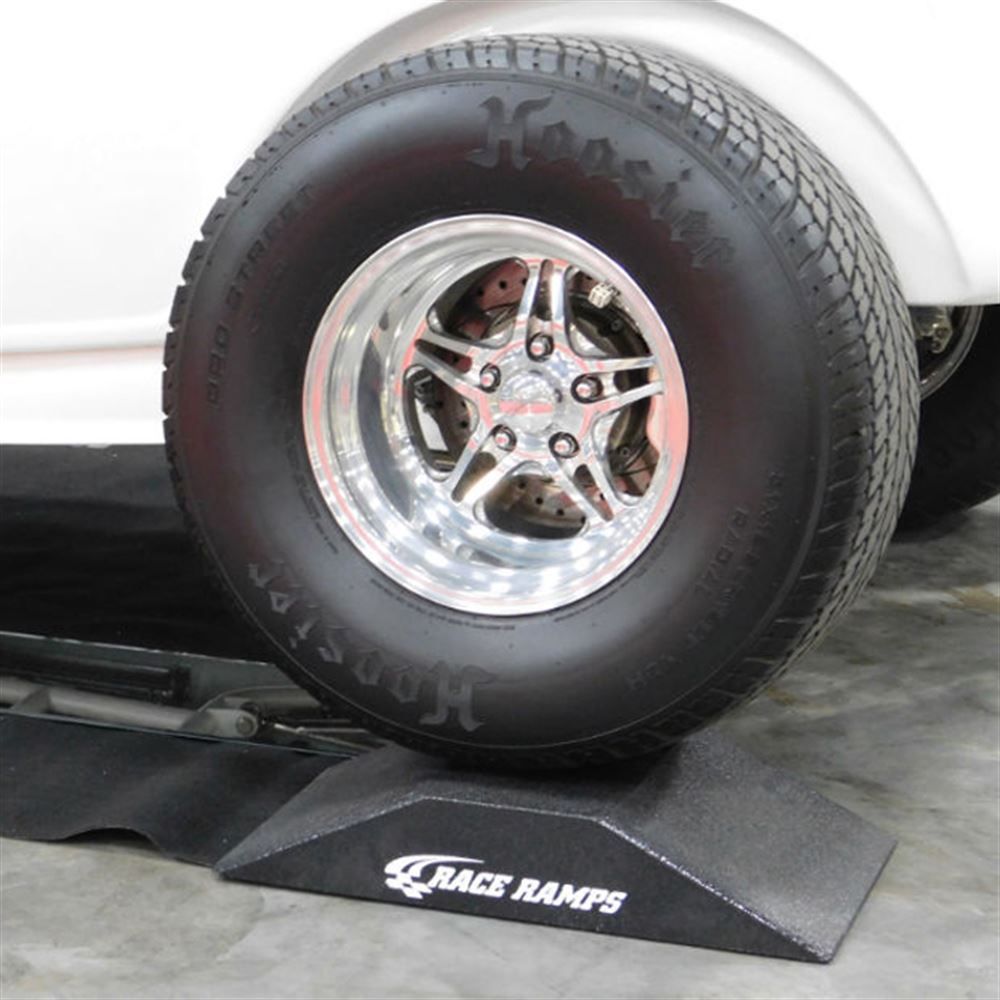 Wide drag tire resting on a Race Ramps Show Ramp