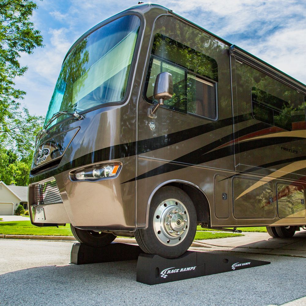 RV front wheel parked on a Race Ramps Super Duty Service Ramp