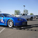 Blue show car driving onto Race Ramps RR-TR-6 trailer ramps behind a pickup truck