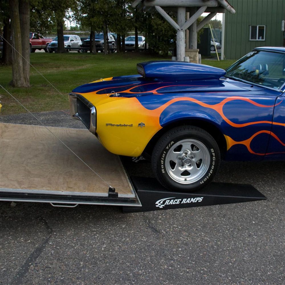 Flamed muscle car loading onto a Race Ramps RR-TR-7 trailer ramp