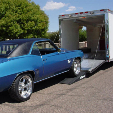 Blue El Camino loading into an enclosed trailer on Race Ramps RR-TR-8XL trailer ramps
