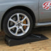 Rear wheel resting on a Race Ramps rear Trailer-Mate on a trailer floor