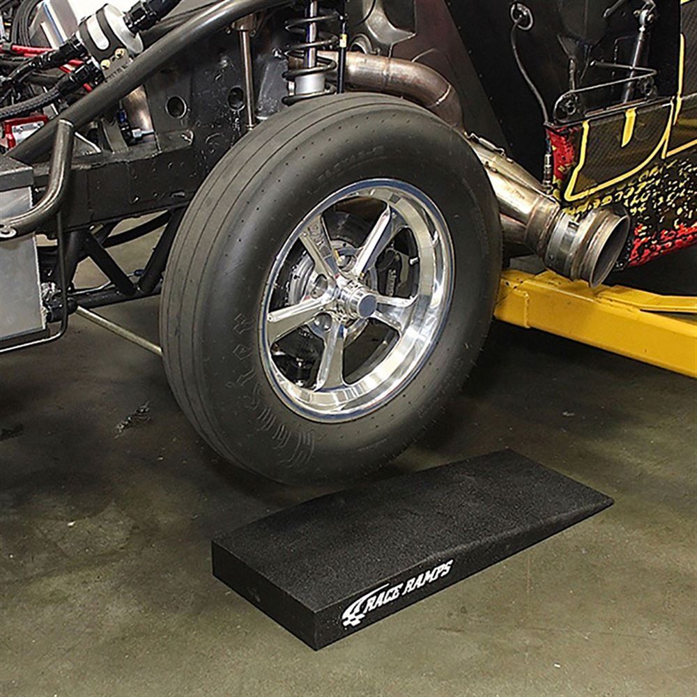 Race car on Race Ramps Trak-Jax ramps in a workshop