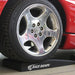 Front wheel of a sports car parked on a Race Ramps Trak-Jax