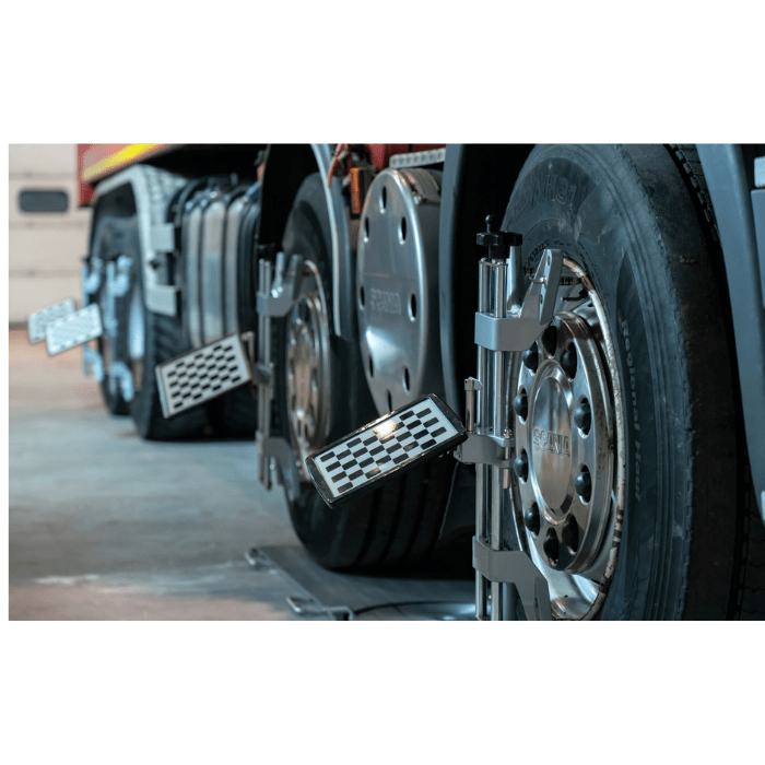 truck wheel alignment machine in use with imaging targets mounted on wheels